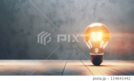 Idea Spark - Glowing Light Bulb on a table - Generative AI 114641442