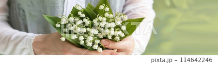a bouquet of lilies of the valley cradled in gentle woman hands a bouquet of lilies of the valley cradled in gentle woman hands 114642246