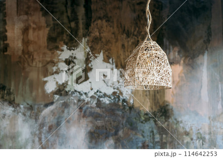 Lamps that are combined with natural ingredients and express the local culture of Thailand against the backdrop of a grand-faced textured loft-style wall Lamps that are combined with natural ingredients and express the local culture of Thailand against the backdrop of a grand-faced textured loft-style wall 114642253
