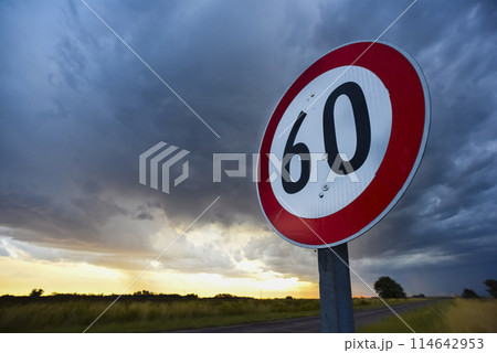 Maximum speed road sign with a stormy sky background, La Pampa province, Patagonia, Argentina. 114642953