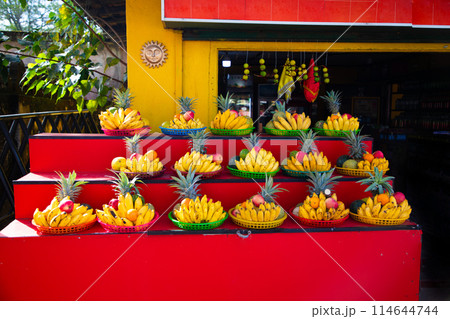 Flowers and fruits collected in baskets for offering to Buddha statue Flowers and fruits collected in baskets for offering to Buddha statue 114644744