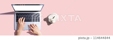 Laptop computer with piggy bank 114644844
