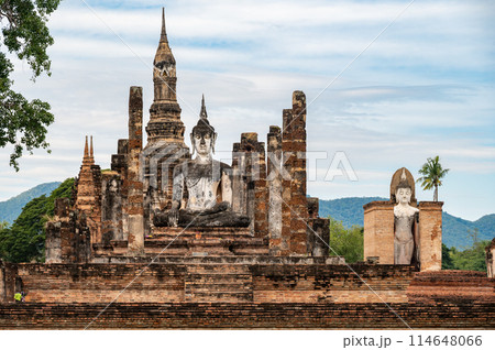 View of Wat Mahathat temple the most important and impressive temple compound in Sukhothai Historical Park. View of Wat Mahathat temple the most important and impressive temple compound in Sukhothai Historical Park. 114648066