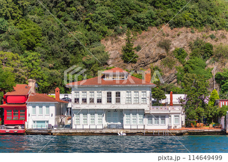 Green mountains of the Asian side of Bosphorus strait, with traditional houses and dense trees in a summer day 114649499
