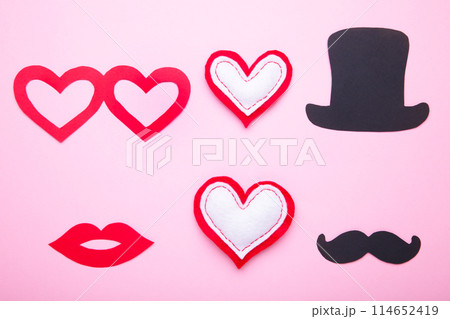 Photo booth colorful props for party with heart on pink background Photo booth colorful props for party with heart on pink background 114652419