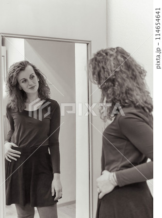 Stylish woman with curly hair in craft textile store, design concept 114654641