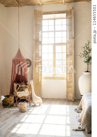 children's room in Scandinavian style, light with bed, toys and a large window with sunlight. wooden furniture 114655501