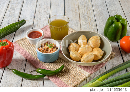 Gol Gappa, also known as Pani Puri or Puchka, is a popular street food snack originating from the Indian subcontinent.  114655648