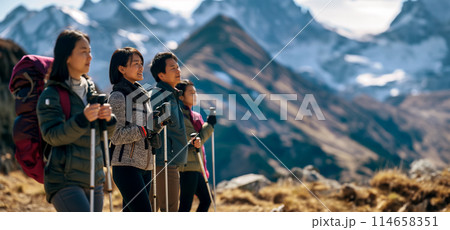 Banner with a portrait of a group of adult tourists admiring the view of the mountains while climbing, tourists holding Nordic walking poles in their hands, active lifestyle Banner with a portrait of a group of adult tourists admiring the view of the mountains while climbing, tourists holding Nordic walking poles in their hands, active lifestyle 114658351