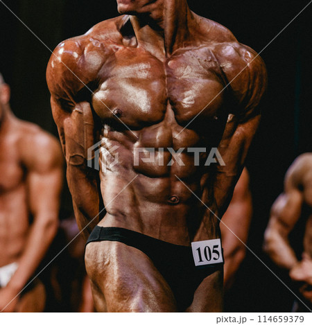 bodybuilder athlete show side triceps pose for bodybuilding competition bodybuilder athlete show side triceps pose for bodybuilding competition 114659379