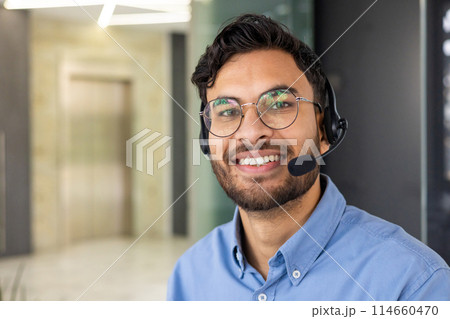 Smiling customer service representative wearing a headset, ready to assist customers in a modern office environment. Perfect for business, communication, and support concepts. Smiling customer service representative wearing a headset, ready to assist customers in a modern office environment. Perfect for business, communication, and support concepts. 114660470