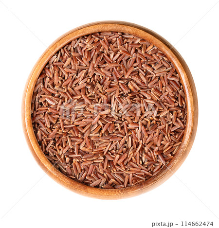 Camargue red rice, in a wooden bowl. Variety of red rice cultivated in the wetlands of the Camargue region of southern France. Rice with intense, somewhat nutty taste and naturally chewy texture. Camargue red rice, in a wooden bowl. Variety of red rice cultivated in the wetlands of the Camargue region of southern France. Rice with intense, somewhat nutty taste and naturally chewy texture. 114662474