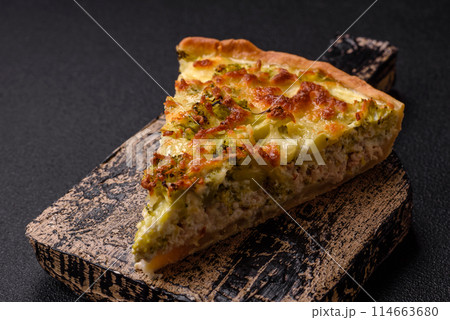 Delicious quiche with broccoli, cheese, chicken, spices and herbs 114663680