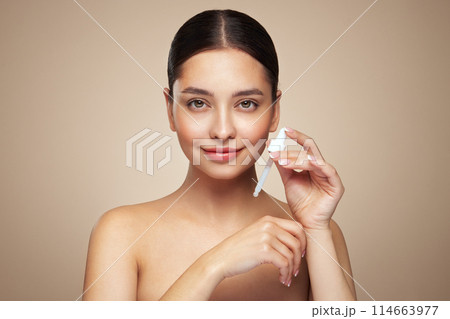 Young woman doing scrapping massage facial skin Young woman doing scrapping massage facial skin 114663977