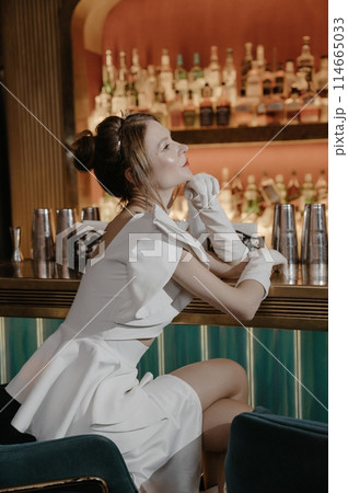 A young couple in wedding looks posing in a stylish loft bar. 114665033