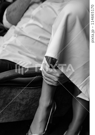 A young couple in wedding looks posing in a stylish loft bar. 114665170