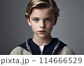 Stunning portrait of a young boy with piercing blue eyes 114666529
