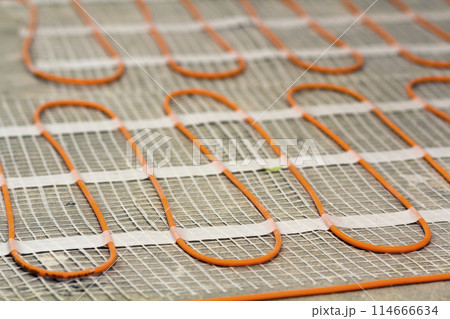 Heating cable for warm floor close-up detail. Renovation works. 114666634