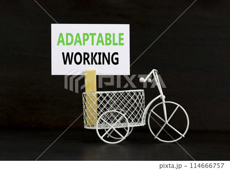 Adaptable working symbol. Concept words Adaptable working on beautiful white paper on wooden clothespin. Beautiful black background. Bike model. Business Adaptable working concept. Copy space. 114666757