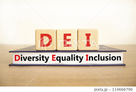 DEI diversity equality inclusion symbol. Concept words DEI diversity equality inclusion on blocks and book. Beautiful white background. Business DEI diversity equality inclusion concept. Copy space. DEI diversity equality inclusion symbol. Concept words DEI diversity equality inclusion on blocks and book. Beautiful white background. Business DEI diversity equality inclusion concept. Copy space. 114666790