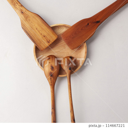Wooden kitchen utensils stacked view, spoon and spatula close up Wooden kitchen utensils stacked view, spoon and spatula close up 114667221