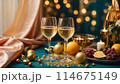A table with champaigne bottle and glasses is covered with a variety of fruits, oranges and lemons 114675149