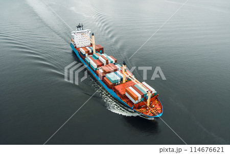 Cargo ship in the ocean carrying containers 114676621