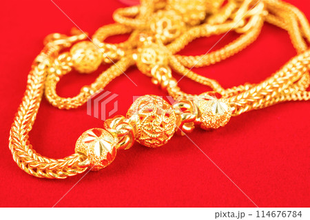 The Gold Bracelet in red velvet box container. 114676784