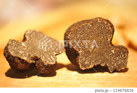 black truffles on a chopping board black truffles on a chopping board 114678816