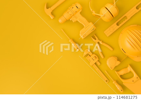 Top view of monochrome construction tools for repair on multicolor background 114681275