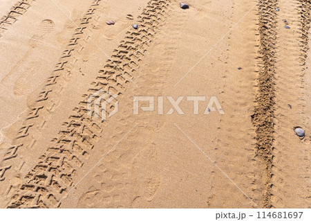 Wheel Tracks on Beach Texture Background, Sand and Rocky Pattern, Red Morocco Beach Wheel Tracks on Beach Texture Background, Sand and Rocky Pattern, Red Morocco Beach 114681697