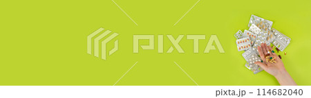 Hand with Color Pill Capsules on Green Background, Overdose Concept, Opioid Problem, Poison, Analgesic 114682040