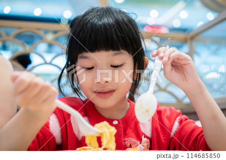Cute little asian child girl eating food 114685850