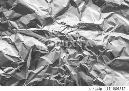 Shiny metal silver gray foil crumpled texture background Shiny metal silver gray foil crumpled texture background 114686815