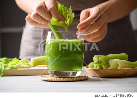 Celery green juice in glass decorative with leaf, Healthy drink for detox, Homemade cooking 114686950