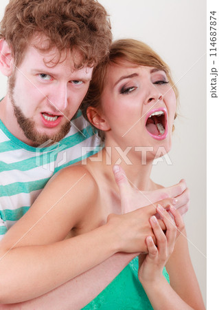 Angry man strangling screaming woman, violence 114687874