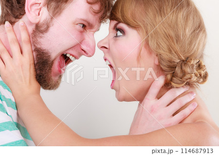Angry woman and man yelling at each other. Angry woman and man yelling at each other. 114687913