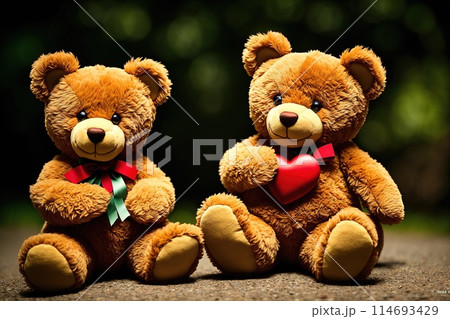 Two teddy bears sitting next to each other, one with a red heart on its chest. Two teddy bears sitting next to each other, one with a red heart on its chest. 114693429