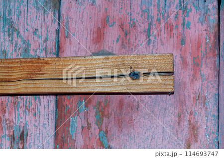 Cracked transverse rail of a wooden door, which was damaged during screwing during the assembly process. Internal Load in Parts, Fractures, Deformation 114693747