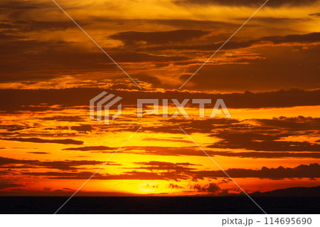 Fiery red sunset over the sea. A terrible bloody evening 114695690