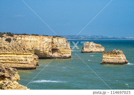 Praia da Marinha Beach among rock islets and cliffs seen from Seven Hanging Valleys Trail, Algarve, Portugal Praia da Marinha Beach among rock islets and cliffs seen from Seven Hanging Valleys Trail, Algarve, Portugal 114697025