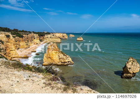 Praia da Marinha Beach among rock islets and cliffs seen from Seven Hanging Valleys Trail, Algarve, Portugal Praia da Marinha Beach among rock islets and cliffs seen from Seven Hanging Valleys Trail, Algarve, Portugal 114697026
