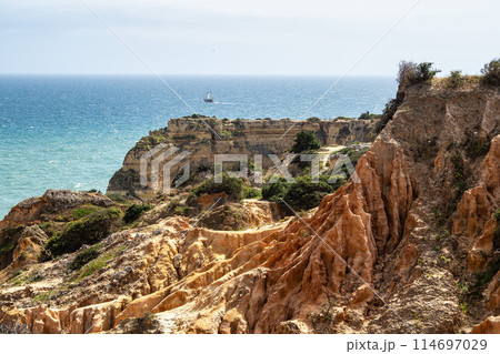 Praia da Marinha Beach among rock islets and cliffs seen from Seven Hanging Valleys Trail, Algarve, Portugal Praia da Marinha Beach among rock islets and cliffs seen from Seven Hanging Valleys Trail, Algarve, Portugal 114697029