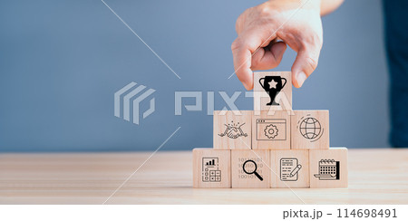 Stack woods block step on table with icon about business strategy and Action plan,business strategy, Goal and target, business development concept. copy space. Stack woods block step on table with icon about business strategy and Action plan,business strategy, Goal and target, business development concept. copy space. 114698491
