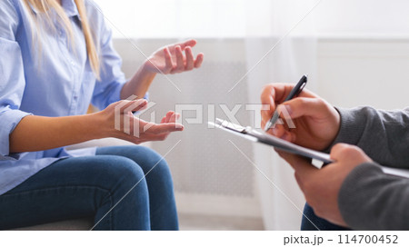 Emotional woman sharing her troubles and gesturing at psychotherapy session, panorama Emotional woman sharing her troubles and gesturing at psychotherapy session, panorama 114700452