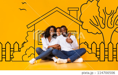 Cute African American family father mother and daughter sitting over drawn on yellow wall house, embracing and smiling. Real estate, mortgage concept 114700506