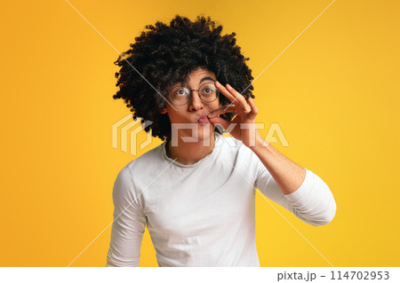 Secret is safely hidden. Black millennial guy locking mouth like zip-lock, orange studio background Secret is safely hidden. Black millennial guy locking mouth like zip-lock, orange studio background 114702953