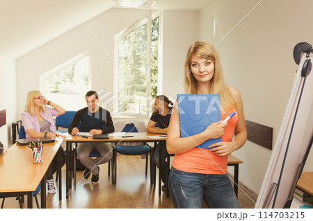 Student girl in front of her mates in classroom 114703215