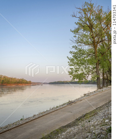 calm spring sunrise over Missouri River at Dalton Bottoms boat ramp 114703341
