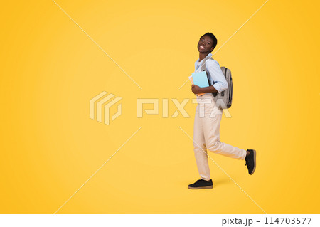 An african american woman on the move, potentially a zoomer, with a backpack full of books highlighting the concept of education, isolated 114703577